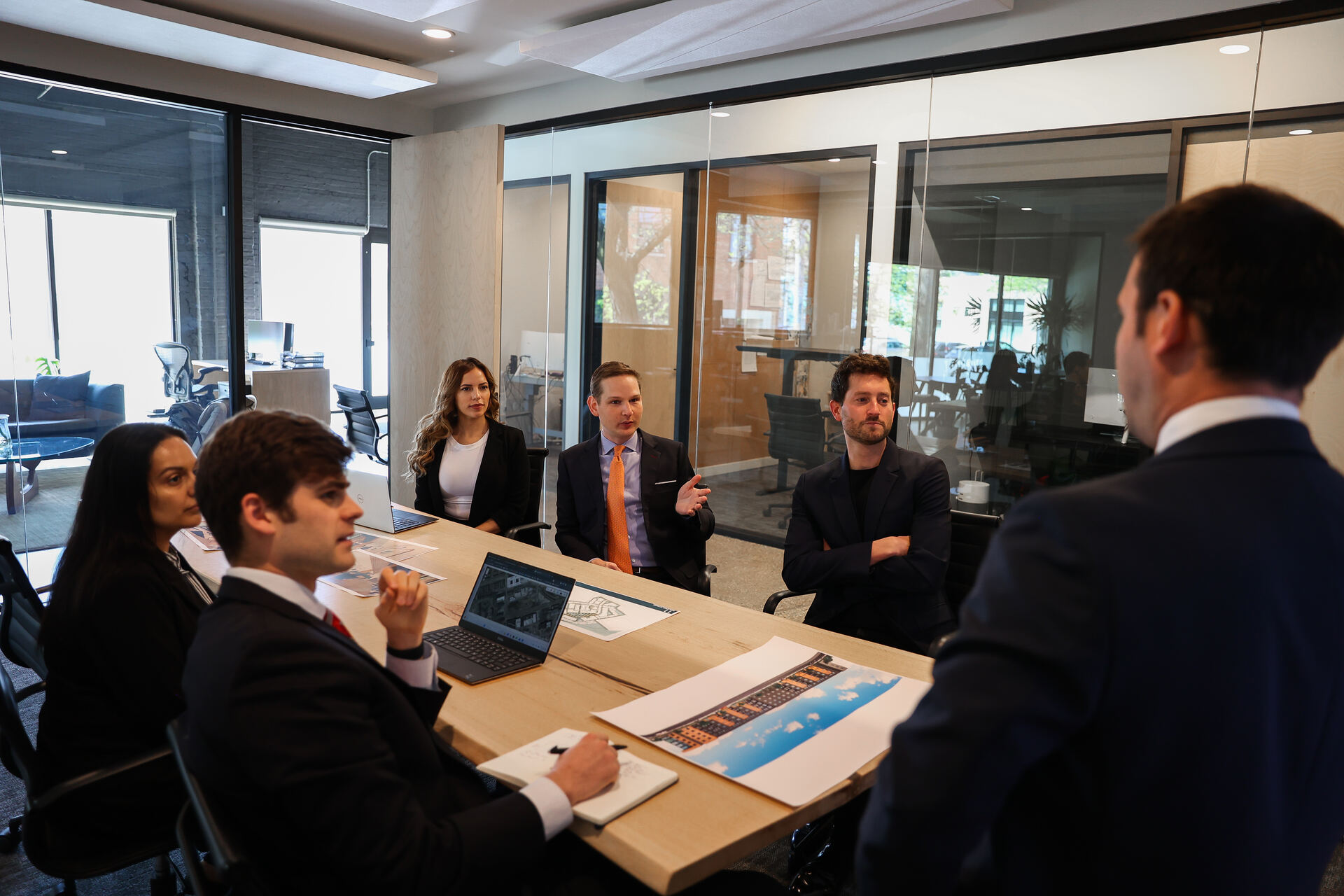 The LEFT Development team reviewing a project in the firm's office